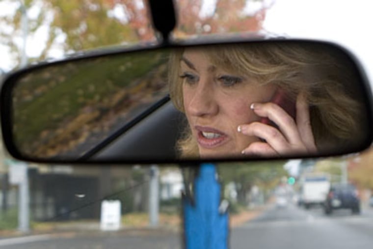 Philadelphia's new cell-phone ban applies to use of any phone or wireless device while driving, skating, skateboarding, or bicycling on any city street. (AP Photo/Don Ryan)