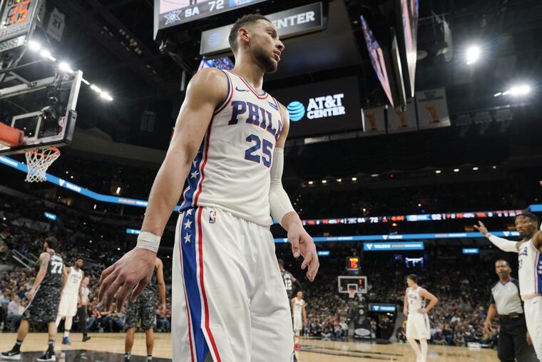 Philadelphia 76ers' Ben Simmons walks toward the 76ers bench during the second half of an NBA basketball game against the San Antonio Spurs, Friday, Jan. 26, 2018, in San Antonio. Philadelphia won 97-78.