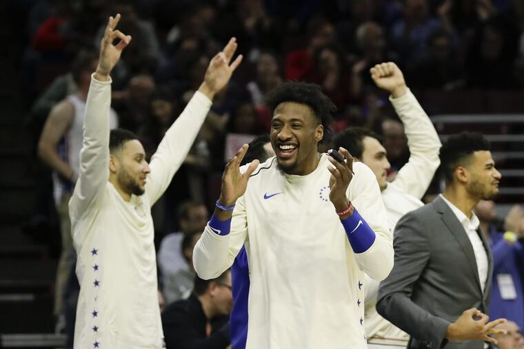 Robert Covington and his teammates celebrate during the Sixers’ 130-95 win over the Milwaukee Bucks in Wednesday’s regular season finale.