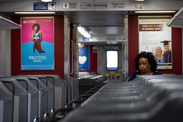 Shontae Burgess of Mount Airy heads to work for Amazon in Wynnewood on a Regional Rail train last month.