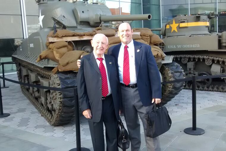 Douglas Cervi , the new executive director of the New Jersey Holocaust Commission on Education, (right) and David Wisnia, a Holocaust survivor, are pictured at a World War II museum in New Orleans where Wisnia was the keynote speaker at a conference.