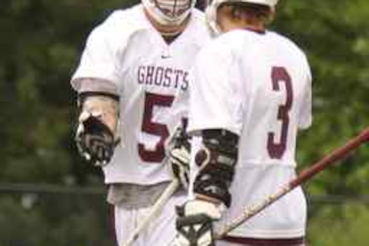 Abington senior Rich Rambo (left) is congratulated by his freshman brother, Matt, after scoring one of his five goals.