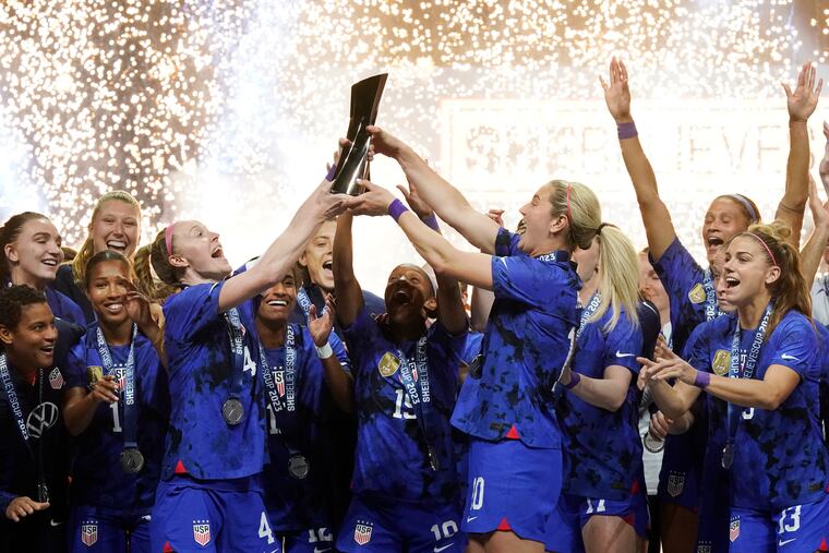United States women's soccer team lifts up and celebrates winning the SheBelieves Cup.