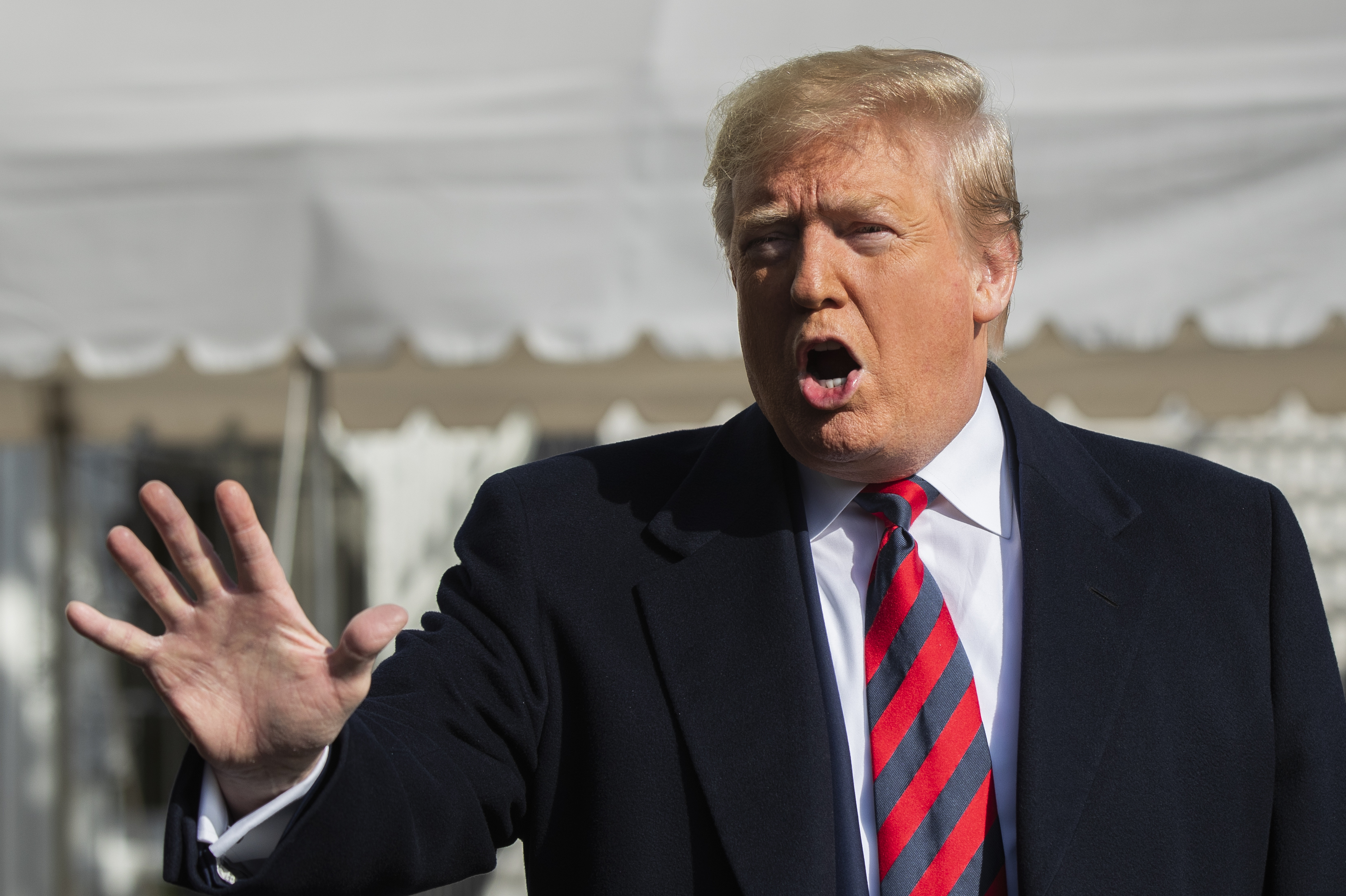 President Donald Trump talks to the media before leaving the White House, Saturday, Nov. 9, 2019, in Washington. Trump is attending the NCAA college football game between Louisiana State University and Alabama in Tuscaloosa, Ala.