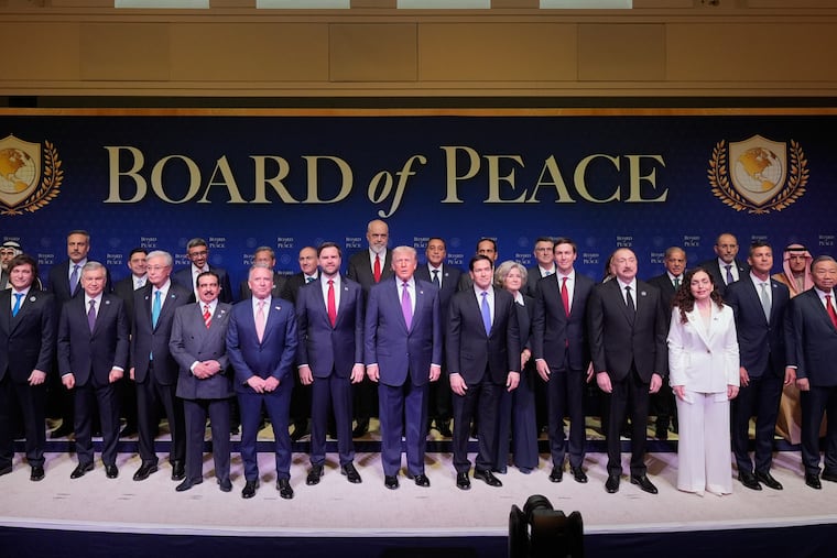 FILE - President Donald Trump stands with other World leaders before a Board of Peace meeting at the U.S. Institute of Peace, Feb. 19, 2026, in Washington.