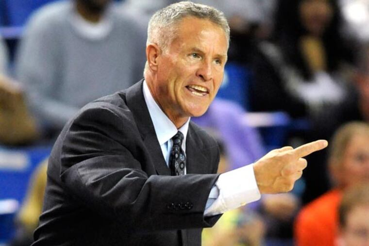 Brett Brown gestures during the first quarter of the 76ers' preseason NBA basketball game against the Boston Celtics on Friday, Oct. 11, 2013, in Newark, Del. (Steve Ruark/AP)