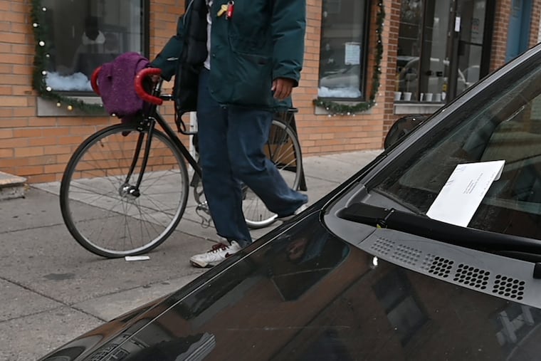 A PPA parking ticket on a car at metered parking along the Passyunk Shopping District in 2021.