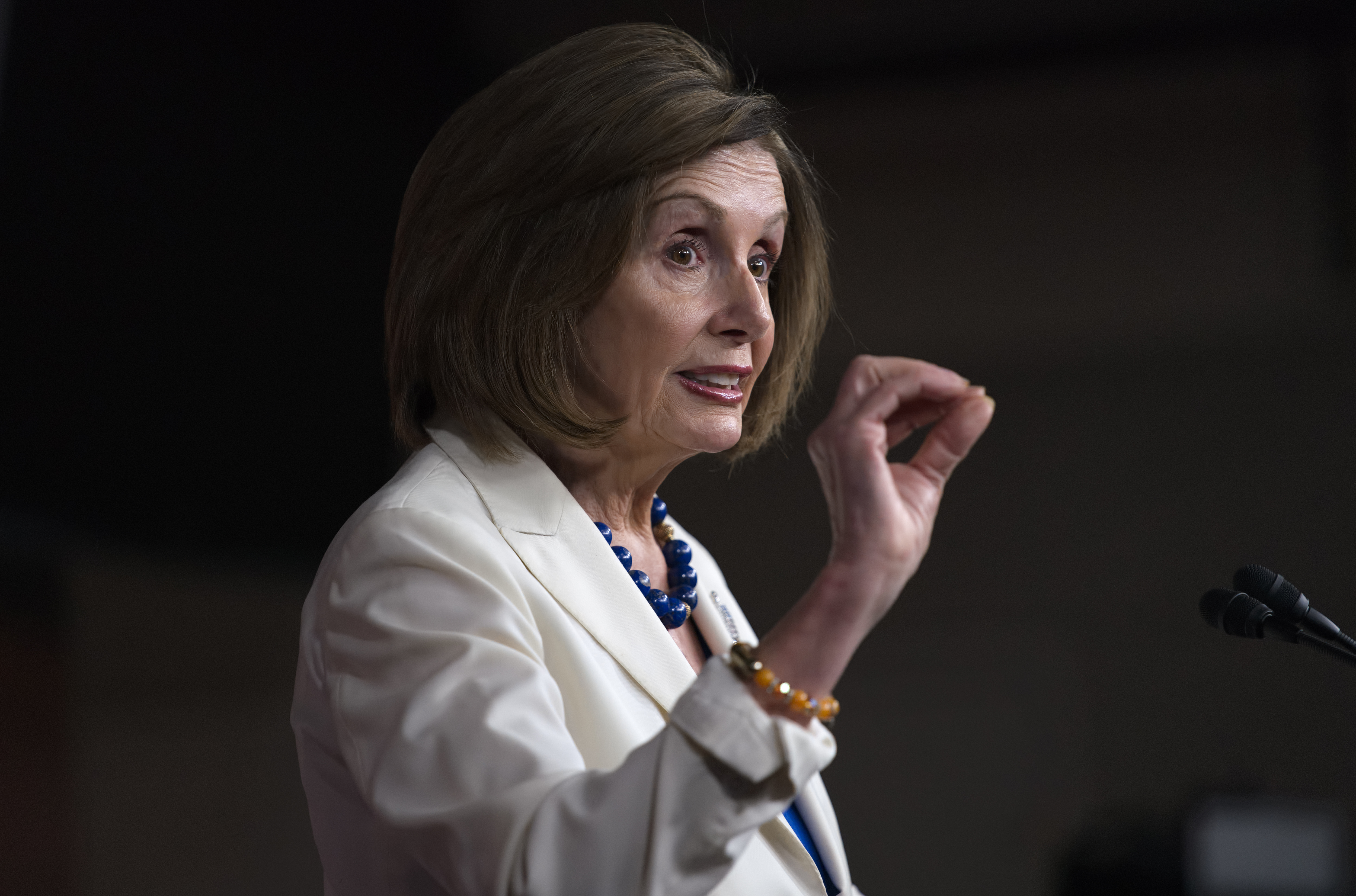 Speaker of the House Nancy Pelosi, D-Calif., talks to reporters as the House Intelligence Committee holds public impeachment hearings of President Donald Trump's efforts to tie U.S. aid for Ukraine to investigations of his political opponents.