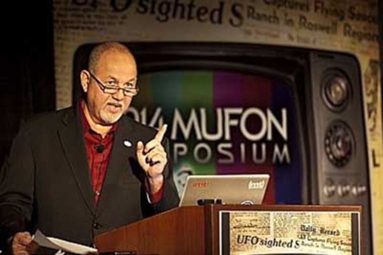 John Ventre, state director of the Mutual UFO Network, addresses an audience gathered for the 45th annual conference of the International Mutual UFO Network at the Crowne Plaza Hotel in Cherry Hill. ( RON TARVER / Staff Photographer ) July 19 2014