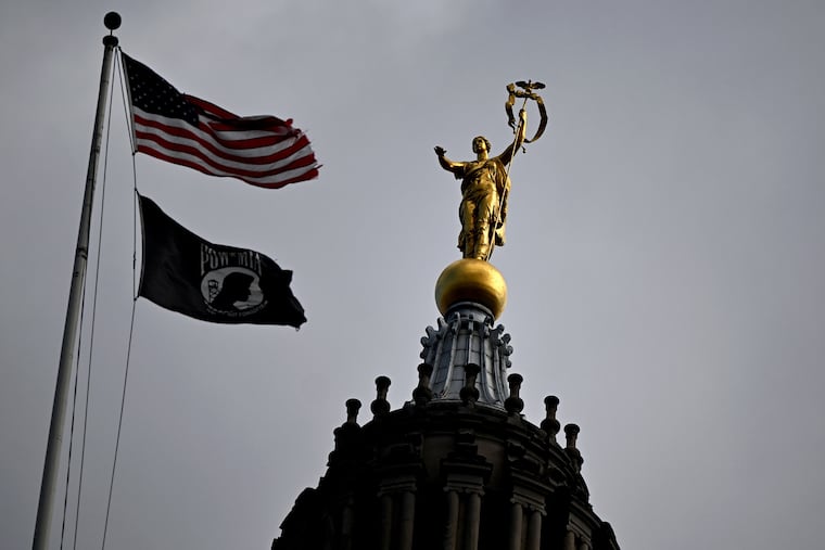 The 1906 beaux arts state capitol building in Harrisburg Feb. 4, 2025. The 14'6” high gilded bronze sculpture by Roland Hilton Perry atop the dome is “Commonwealth.” She holds a garlanded mace in her left hand upholding the standard of statehood. The right hand is extended in benediction. ( legislature commonwealth government general assembly senate statehouse representatives capital Pennsylvania )