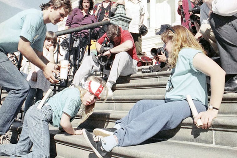 “Capitol crawlers” left behind crutches and wheelchairs in 1990 protest. (JEFF MARKOWITZ / Associated Press)