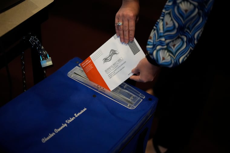 A mail-in ballot for the 2024 General Election is returned at the Chester County Government Services Center in West Chester on Friday.