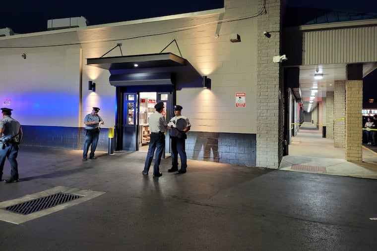 Police at the shooting scene Monday night outside a Chick-fil-A on the 800 block of Adams Avenue in Crescentville.