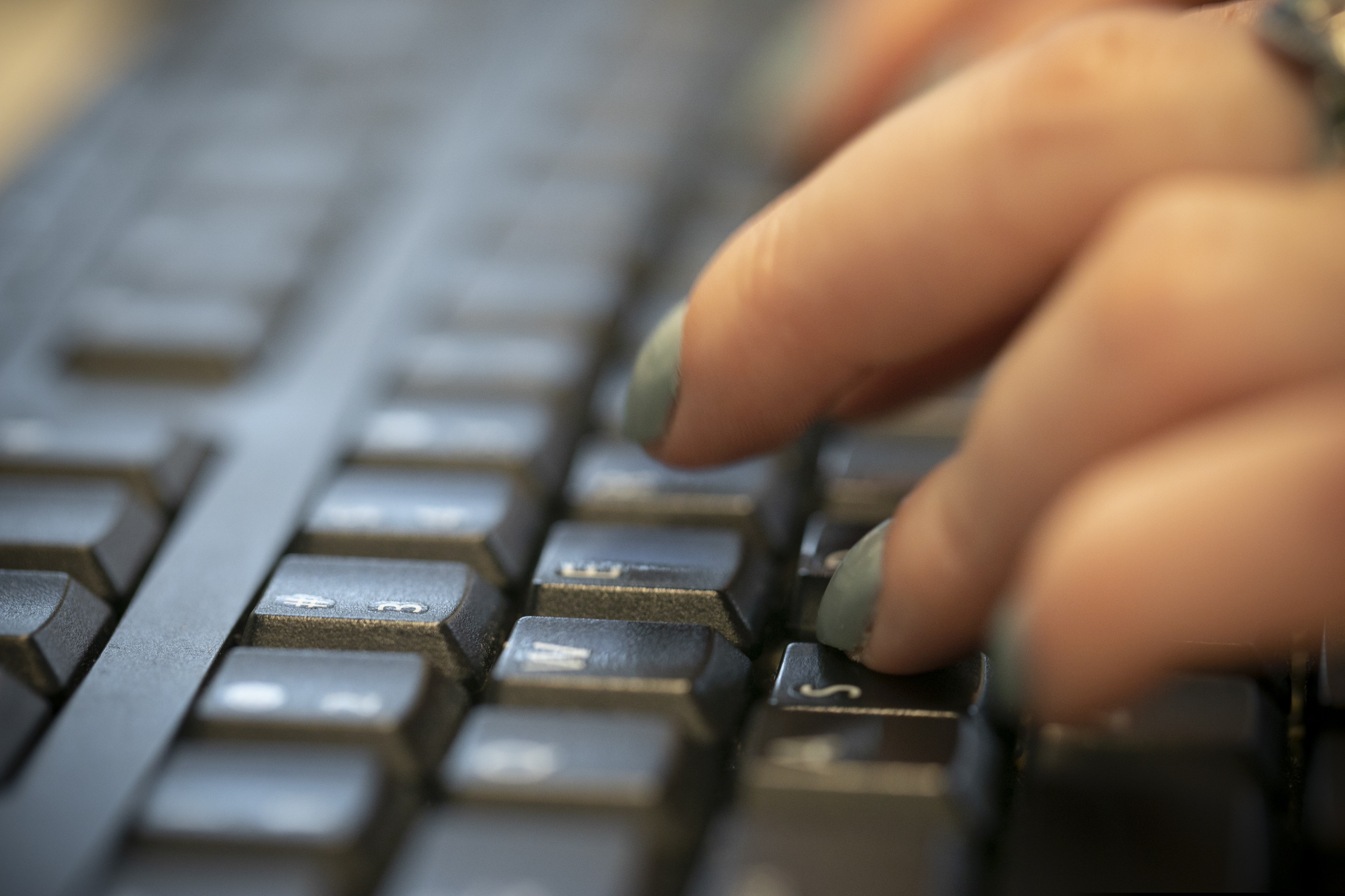 In this Oct. 8, 2019, photo, a woman types on a keyboard in New York. Cybersecurity represents a growing concern for small businesses. (AP Photo/Jenny Kane)