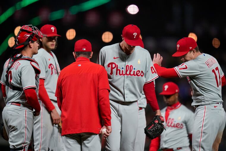 Phillies starting pitcher Kyle Gibson, second from right, is pulled from the game against the San Francisco Giants during the second inning Friday in San Francisco.