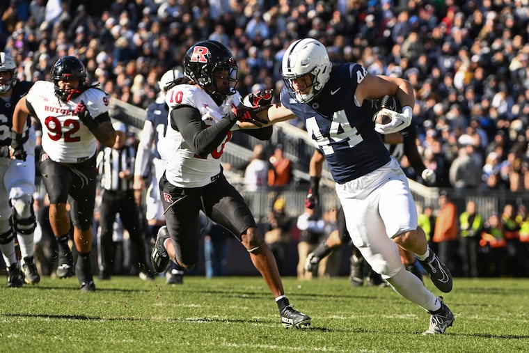 Tyler Warren (44) runs past Rutgers defensive back Flip Dixon (10) in Penn State's 27-6 win over Rutgers on Saturday in Happy Valley.
