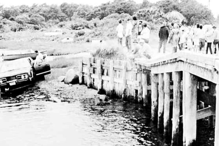 Kennedy's car is pulled from the water after it ran off a bridge on Chappaquiddick Island. Kopechne had been found near a backseat wheel well, an apparent victim of suffocation.