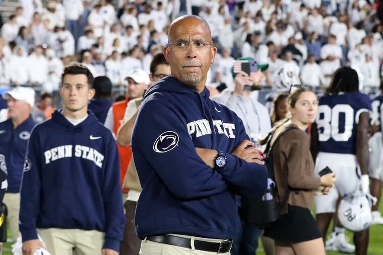 Penn State's head football coach, James Franklin, stands on the field Saturday after a loss to the Northwestern Wildcats at Beaver Stadium. He was fired less than 24 hours later.