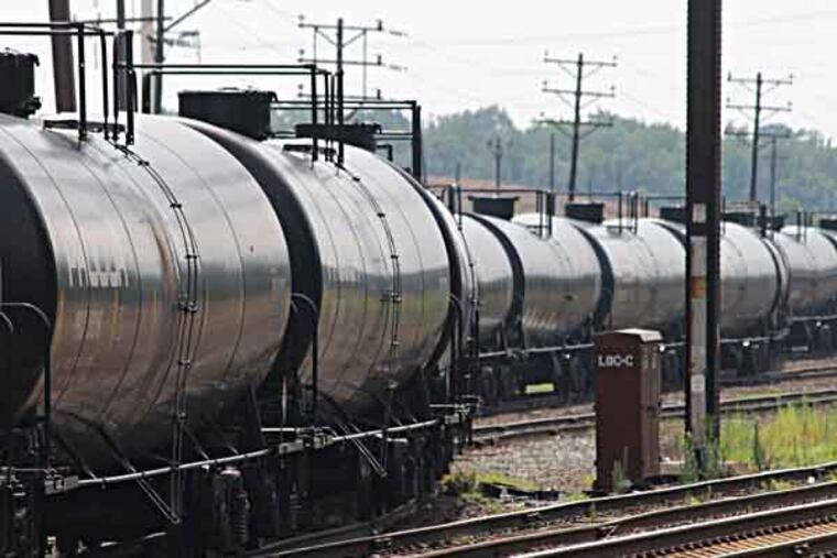 Empty railroad tank cars snake their way into a storage yard in Newark, Delaware, July 28, 2013 The cars will return to North Dakota's Bakken region to be loaded with crude oil for another trip to the refinery at Delaware City, Delaware. With a shortage of new pipeline capacity, oil producers have been using rail as an alternative, and in some cases it's the preferred mode. (Curtis Tate/MCT)