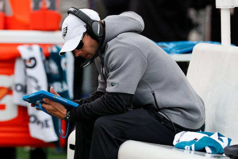 Eagles Defensive Coordinator Jonathan Gannon looks at his tablet while the Eagles played the New Orleans Saints on Sunday, November 21, 2021 in Philadelphia.