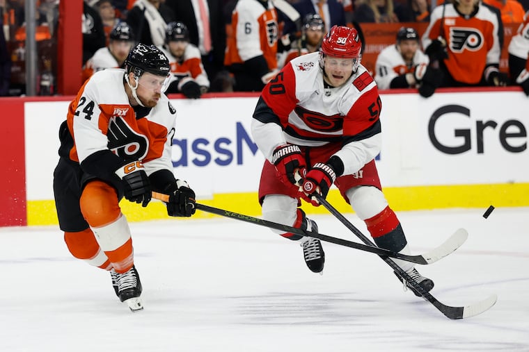 Carolina Hurricanes left wing Eric Robinson (right) played 7 minutes, 41 seconds of Game 3 on Thursday.