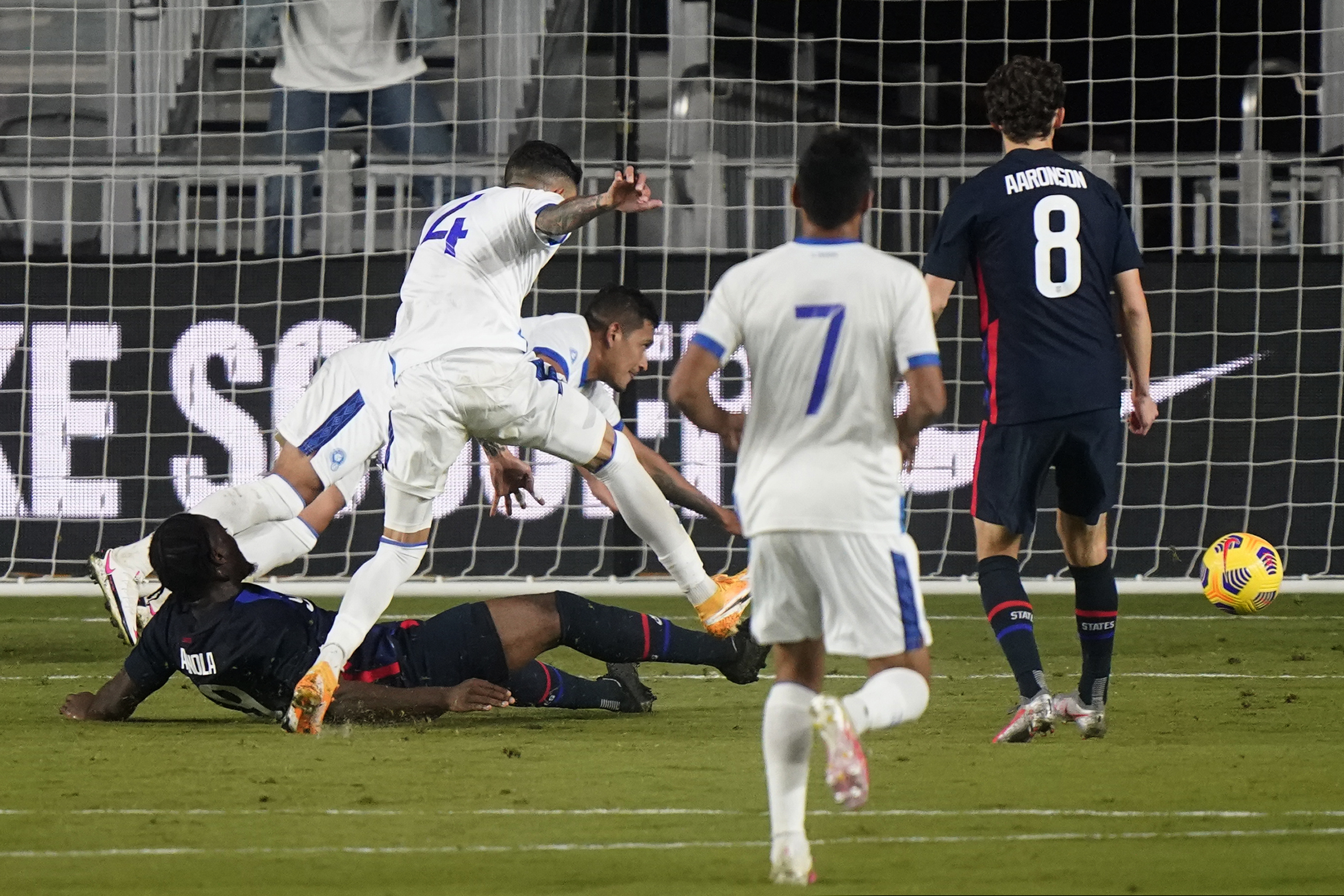 Brenden Aaronson (8) watches as a shot by U.S. forward Ayo Akinola (on the ground) goes into the net during the first half.