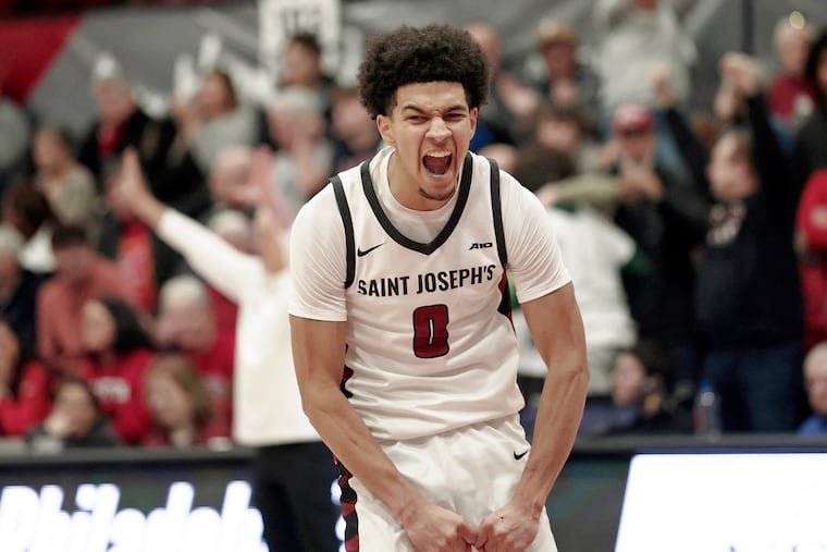 St. Joe’s Derek Simpson after dunking the basketball against Dayton on Saturday.