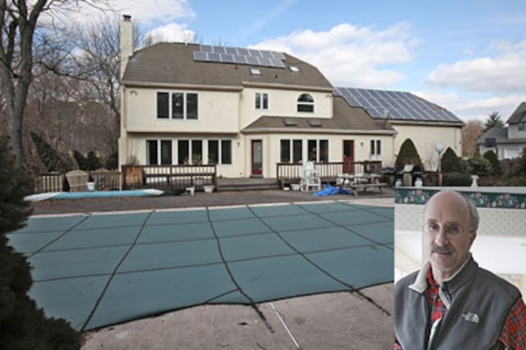 The view of Dr. Gerald Feigin's home in Sewell, N.J., from the tent he has been sleeping in for the last six months. (David M Warren / Staff Photographer)