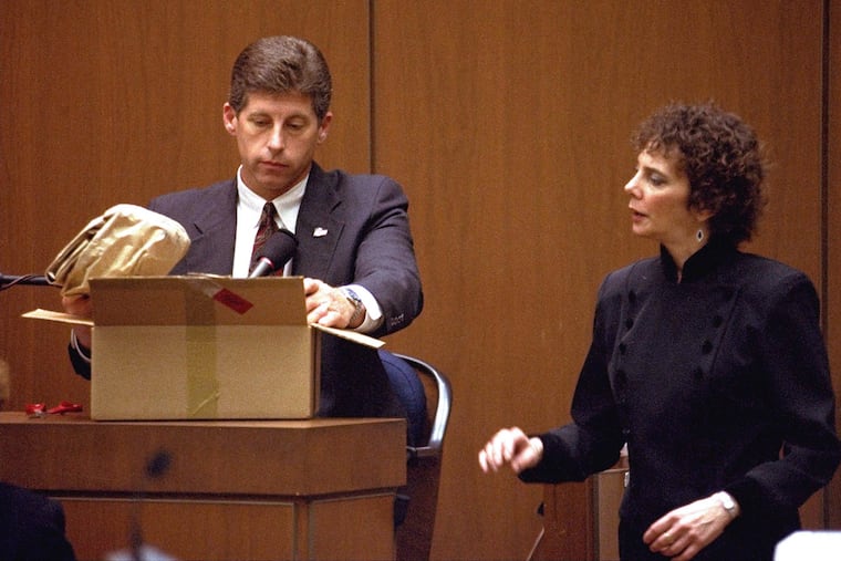 Los Angeles Police Detective Mark Fuhrman shows evidence to the jury in the O.J. Simpson double murder trial during testimony on March 10, 1995, in Los Angeles.