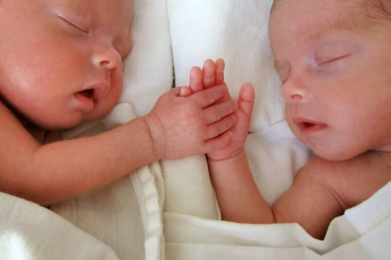 These twins were born prematurely and weighed less than 4 pounds each.
