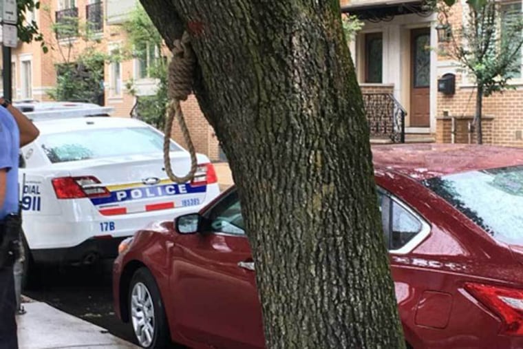 Police investigate a noose found at 18th and Lombard Streets on July 7,