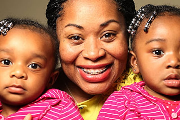 Mecca Baker of Marlton got braces after pregnancy with her twins — Regan (left) and Briea — sapped her calcium and caused her teeth to separate. (MICHAEL BRYANT / Staff Photographer)