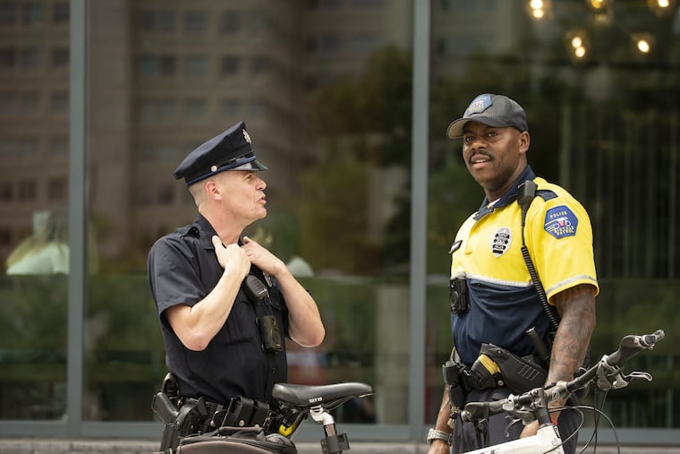 Andrew Lanetti, at left, president of the Temple University Police Association, the union, talks with and Elijah Lewis, a Temple police lieutenant.