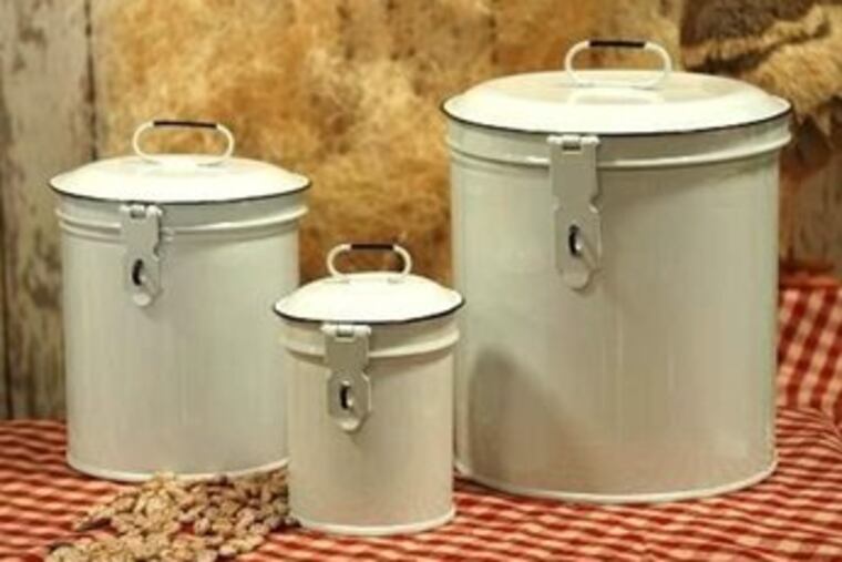 Metal canister sets replaced wood in the mid-1800s to protect flour and sugar from moisture. These enamel reproductions by Kraft Klub are reminiscent of those used in the '50s when people actually used flour and sugar to make bread and cake, instead of boxed mixes. Available in aqua, red and white, the price seems reasonably retro.