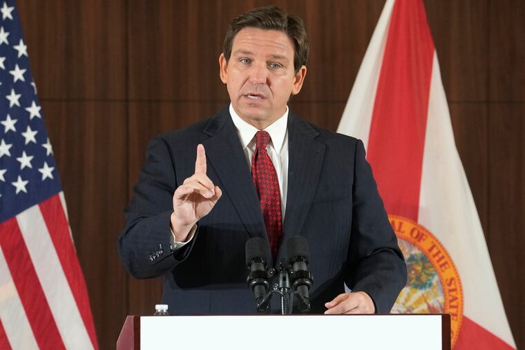 Florida Gov. Ron DeSantis gestures during a news conference, Thursday, Jan. 26, 2023, in Miami. DeSantis on Tuesday, Jan. 31, 2023, announced plans to block state colleges from having programs on diversity, equity and inclusion, and critical race theory.
