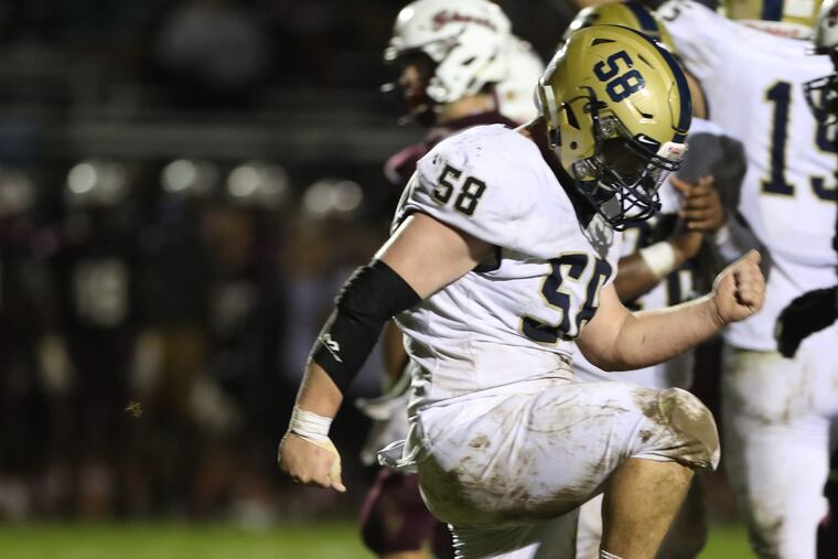 Council Rock South defensive lineman T.J. Pritz (58) celebrates a sack in last Friday's 14-10 defeat of Abington.