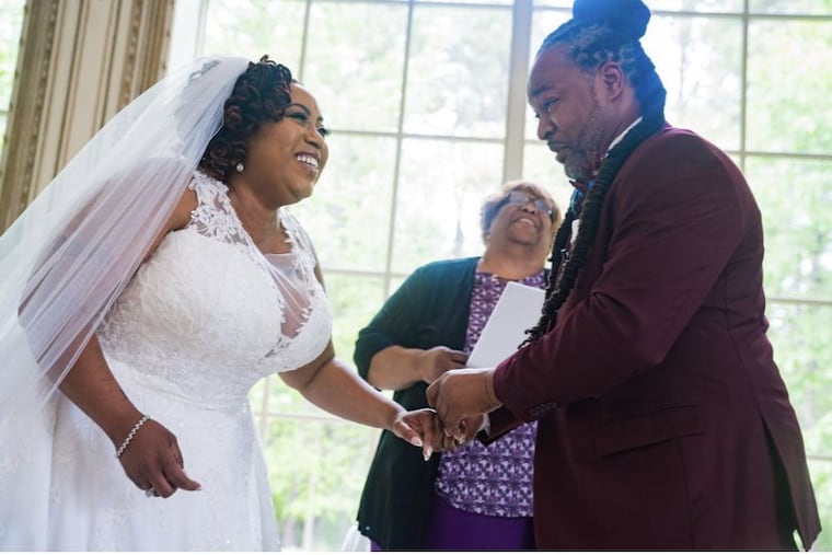 The couple with their officiant, Minister Dawn Duppins. She prayed for the couple during their first wedding, by phone due to the pandemic.