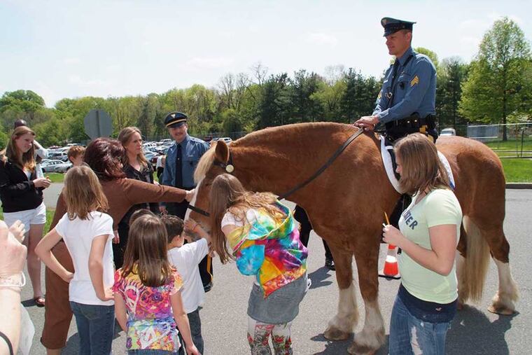 Sprout and Lt. Ted Schafer, his owner. The horse, who died this week at 22, drew a crowd whenever he showed up at community events.