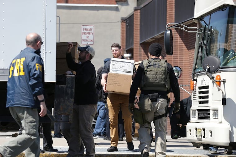 Boxes are loaded on a truck as the FBI raids the Urban Treatment Center at 5th and Market streets in Camden, NJ on April 18, 2018.