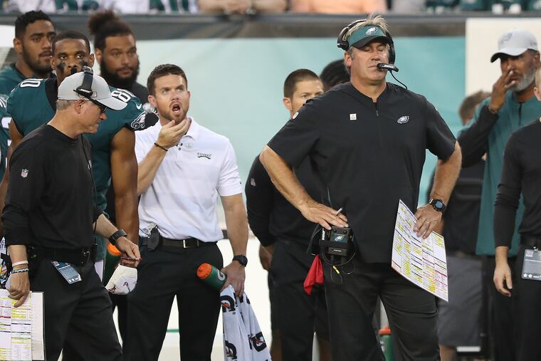 Eagles head coach Doug Pederson, right, closes his eyes as he sends out the kicker to attempt a field goal in the 3rd quarter against the Vikings. Philadelphia Eagles lose 23-21 to the Minnesota Vikings in Philadelphia, PA on October 7, 2018. DAVID MAIALETTI / Staff Photographer