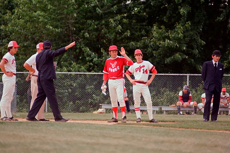Frank Trotman (hand raised in this undated photo), former coach for Haddon Township and Haddonfield, has died.