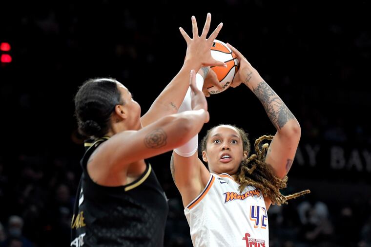Phoenix Mercury center Brittney Griner shoots against Las Vegas Aces center Liz Cambage during the semifinals of the WNBA playoffs last year.