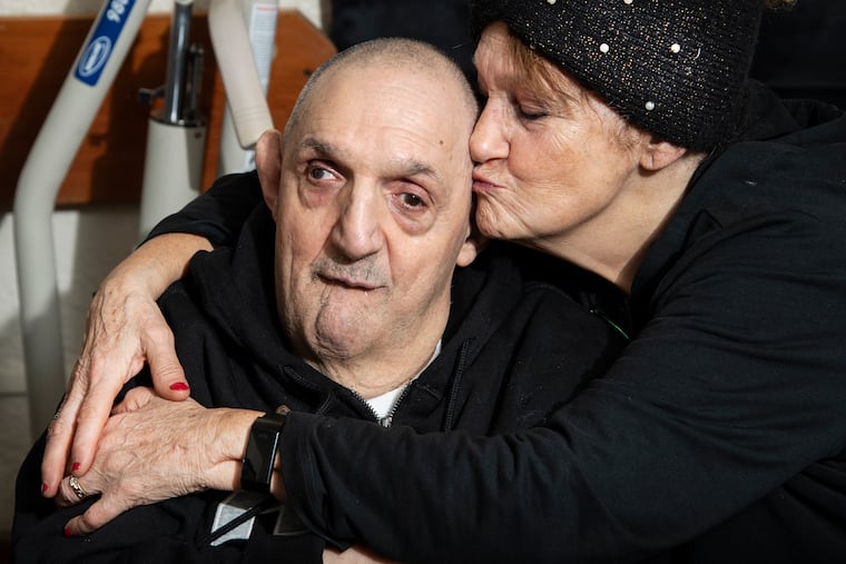 Sharon Gaiptman kisses her brother Lenny at his home in Philadelphia.