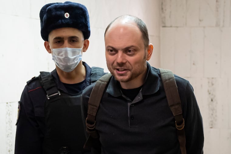 Russian opposition activist Vladimir Kara-Murza is escorted to a hearing in a court in Moscow, Russia, in February.