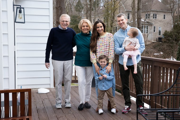 The Welsh family — (from left) Ed, Carol, Ana, Dylan, 4, Eddie and Monroe, 1 — on the back porch of their home in Radnor. When Ana and Eddie are working from home, they send the children downstairs to spend time with their grandparents.