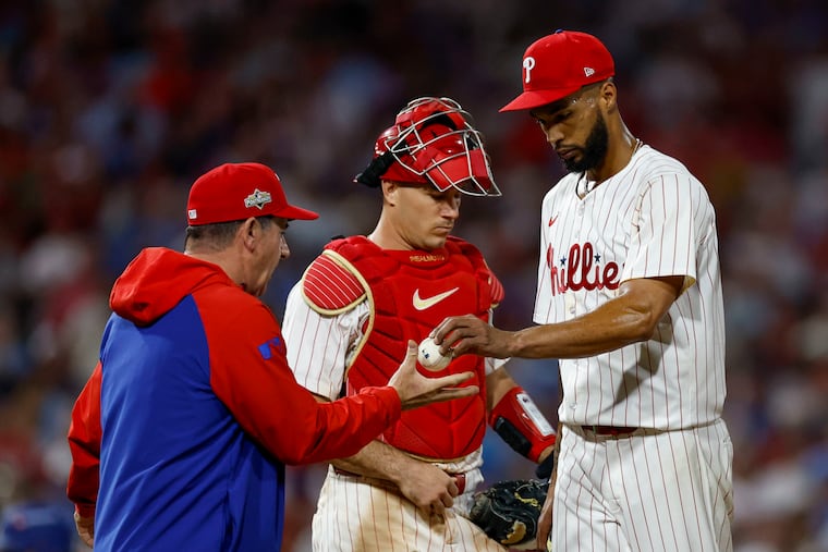 Phillies manager Rob Thomson replaces starter Cristopher Sánchez in the sixth inning of Game 1 as catcher J.T. Realmuto stands by.