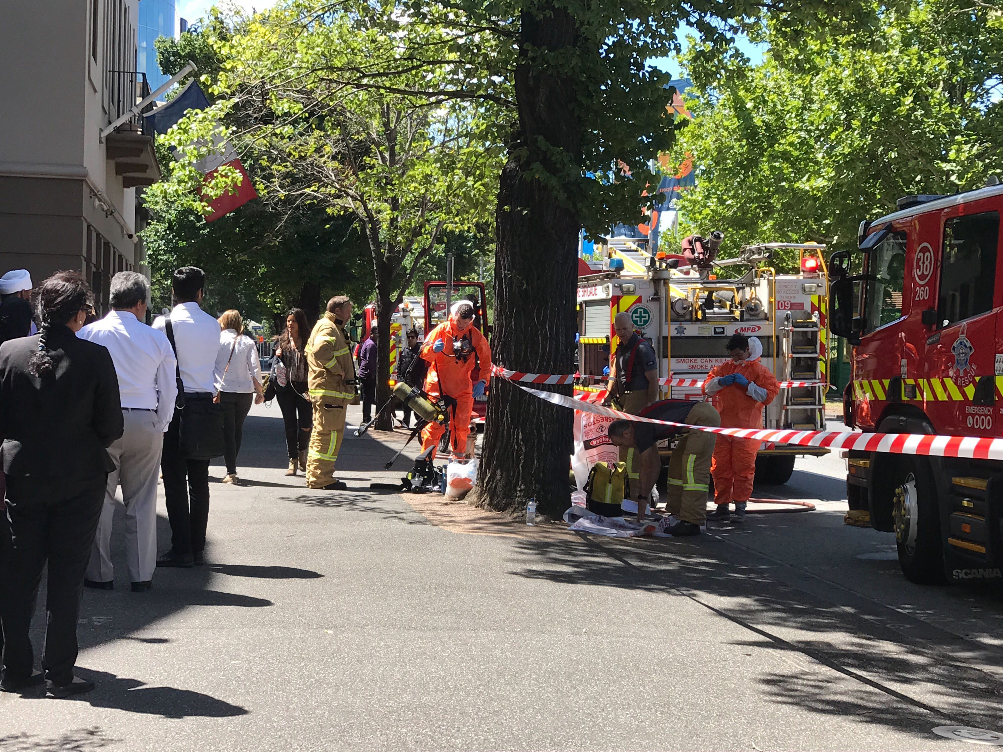 Hazmat and fire crews work outside the Indian and French Consulate in Melbourne, Australia Wednesday, Jan. 9, 2019. At least seven international consulates were evacuated in Melbourne, Australia, on Wednesday after reports that multiple suspicious packages had been sent to them. (Kaitlyn Offer/AAP Image via AP)