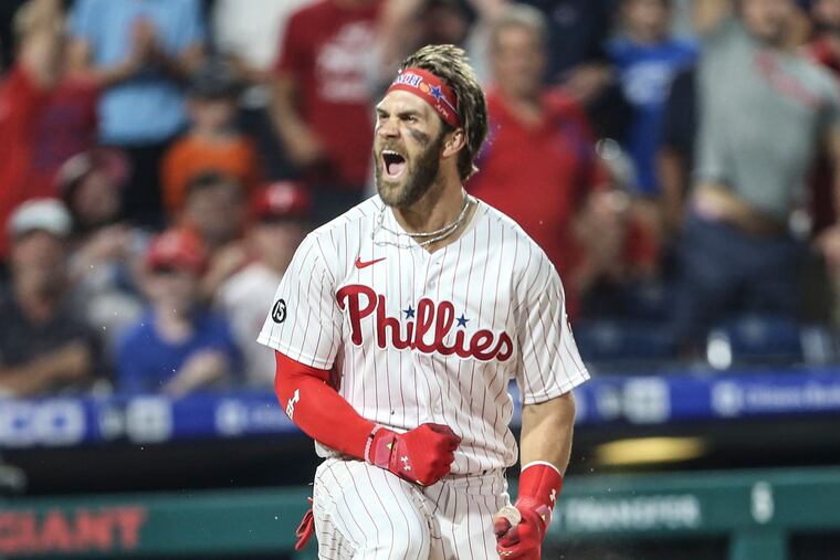 Philadelphia Phillies' Bryce Harper celebrates an inside-the-park homer against the Washington Nationals on July 27, 2021. (Steven M. Falk/The Philadelphia Inquirer/TNS)