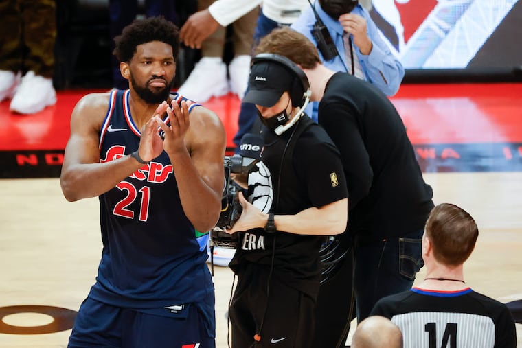 Sixers center Joel Embiid claps towards game official referee Matt Malloy after the Sixers lost game four of the first-round Eastern Conference playoffs against the Toronto Raptors on Saturday, April 23, 2022 in Toronto. The Raptors force a game five after beating the Sixers 110-102.