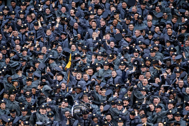 Army cadets celebrate a touchdown during the 120th Army-Navy game at Lincoln Financial Field in South Philadelphia on Saturday, Dec. 14, 2019.